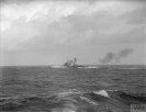 HMS Naiad firing in heavy seas. January 1942. © IWM (A 9574)